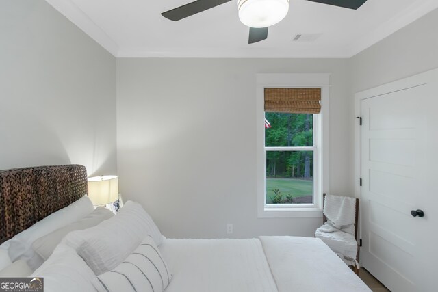 bedroom featuring ceiling fan and visible vents