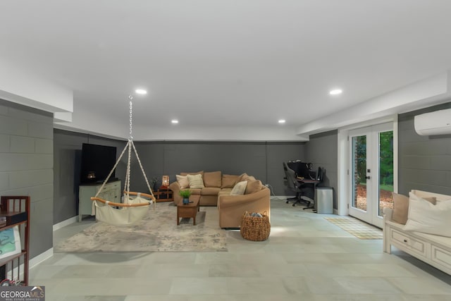 living room with tile patterned floors, french doors, a wall unit AC, and recessed lighting