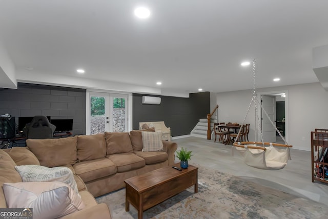 living area featuring baseboards, stairs, recessed lighting, and a wall mounted AC