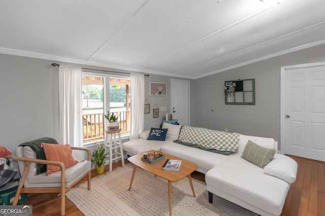 living room featuring ornamental molding and wood finished floors