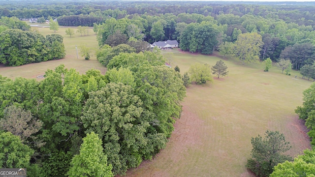 birds eye view of property featuring a rural view