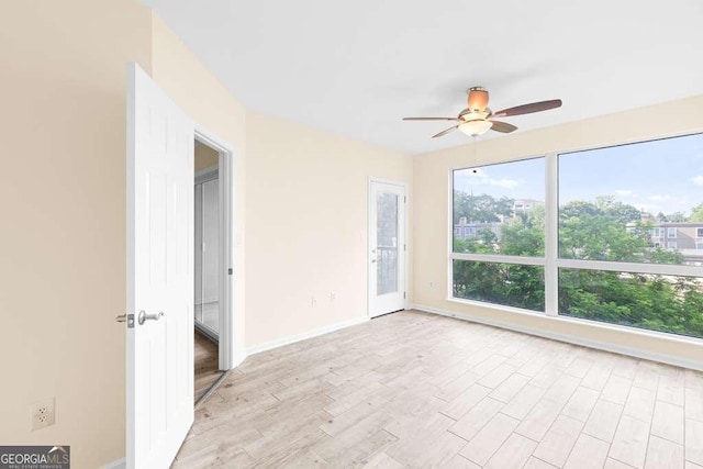 275 13th St NE Unit 409, Atlanta, GA 30309 - unfurnished room featuring ceiling fan and light wood-style flooring