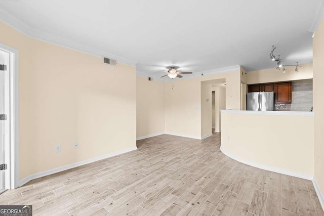 unfurnished living room with a ceiling fan, baseboards, visible vents, and light wood-type flooring