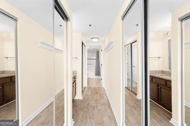 hallway featuring light wood finished floors