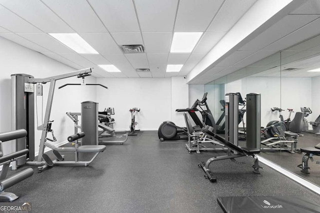 exercise room featuring visible vents and a drop ceiling