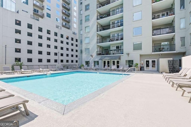 pool featuring a patio and french doors