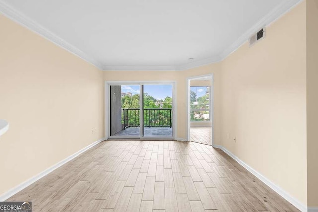 275 13th St NE Unit 409, Atlanta, GA 30309 - unfurnished room with crown molding and light wood-type flooring