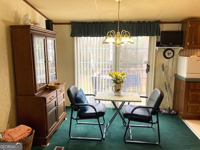 106 Paul Revere Dr, Cusseta, GA 31805 - dining space with a chandelier, dark colored carpet, and plenty of natural light