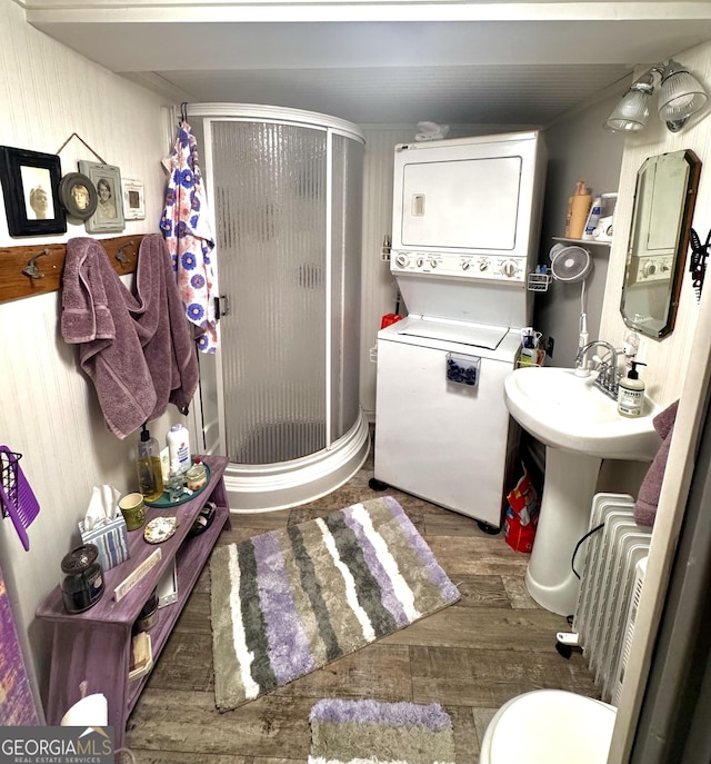 50 Rocky Ln, Cleveland, GA 30528 - bathroom featuring a stall shower, stacked washer and dryer, and wood finished floors