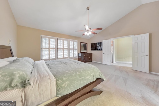 bedroom featuring light colored carpet, baseboards, a ceiling fan, and high vaulted ceiling