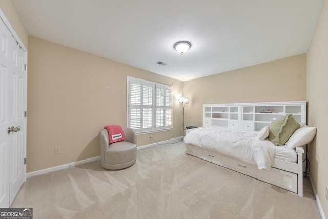 carpeted bedroom with baseboards