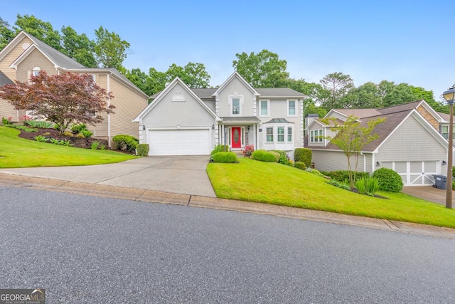 traditional-style house featuring concrete driveway, a front yard, and stucco siding