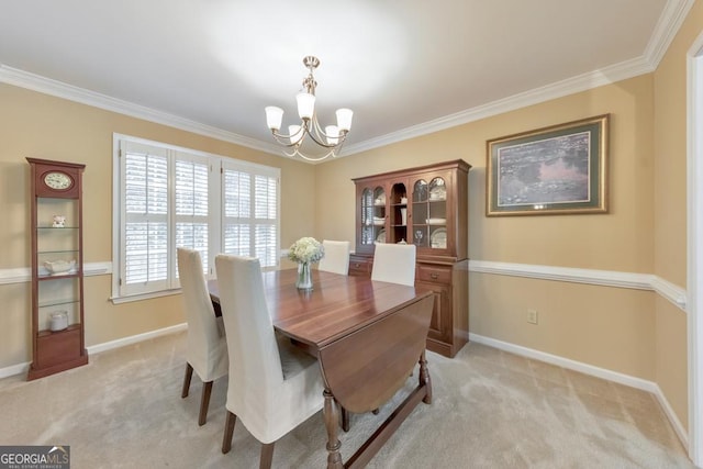 dining room featuring a chandelier, light carpet, crown molding, and baseboards