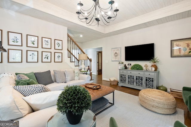 505 River Ridge Rd, Clarkesville, GA 30523 - living area with wood finished floors, a tray ceiling, stairway, baseboards, and a chandelier