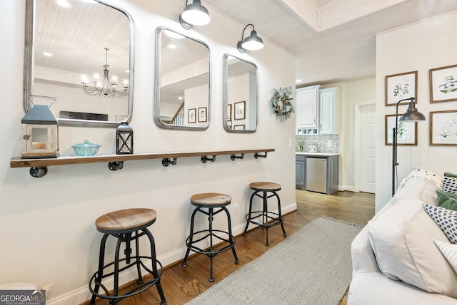 505 River Ridge Rd, Clarkesville, GA 30523 - bar with wood finished floors, baseboards, fridge, and backsplash