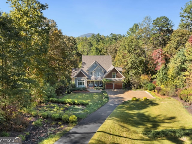 505 River Ridge Rd, Clarkesville, GA 30523 - view of front of house with concrete driveway, a wooded view, a front lawn, and a garage