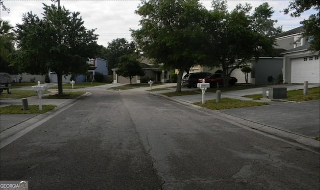 view of street featuring curbs and a residential view