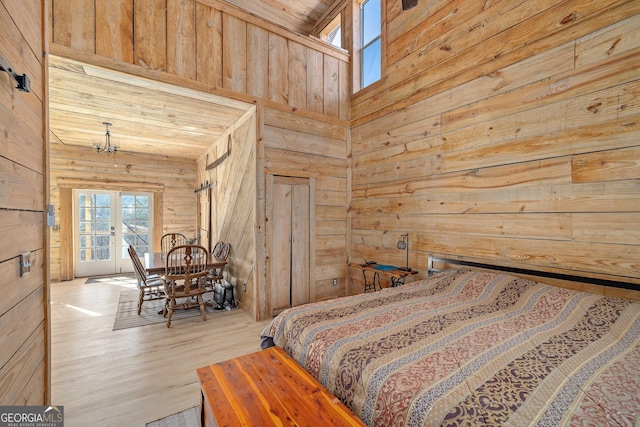 164 Delilah Ln, Lakemont, GA 30552 - bedroom with wood walls, access to exterior, and wood finished floors