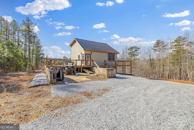 164 Delilah Ln, Lakemont, GA 30552 - exterior space with metal roof, a wooden deck, and gravel driveway