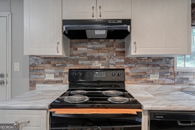 kitchen with under cabinet range hood, white cabinetry, black appliances, and backsplash