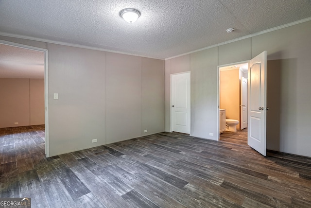 unfurnished bedroom featuring a textured ceiling, ornamental molding, and dark wood-style floors