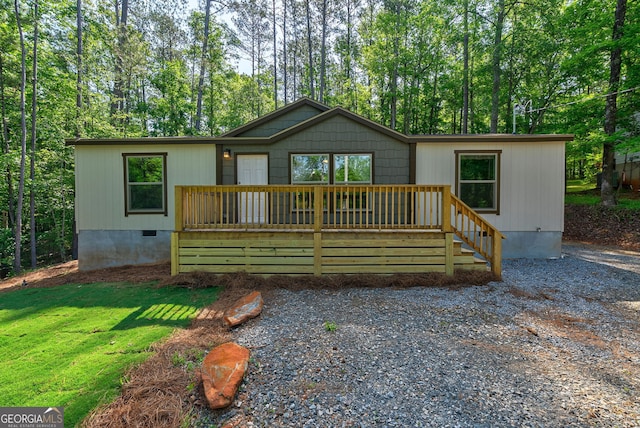 view of front of house featuring a wooden deck and crawl space