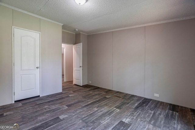 unfurnished bedroom featuring a decorative wall, crown molding, a textured ceiling, and wood finished floors