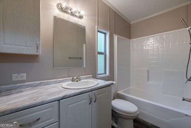 bathroom with toilet, tub / shower combination, a textured ceiling, vanity, and ornamental molding