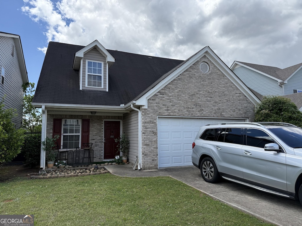 view of front of house with a porch, an attached garage, brick siding, concrete driveway, and a front lawn