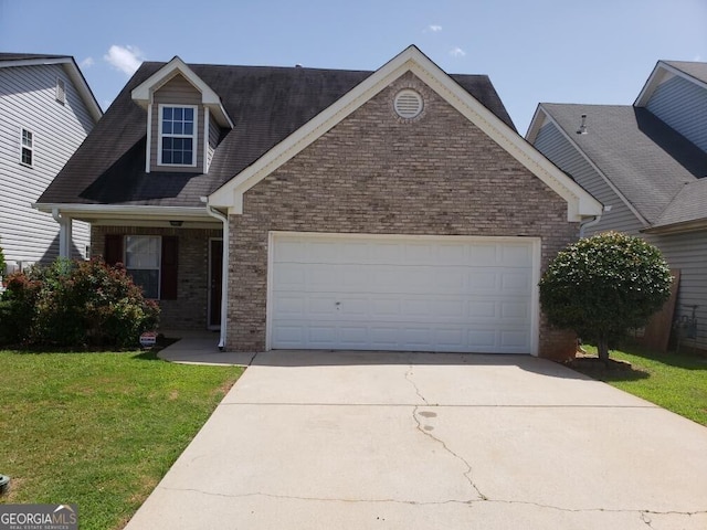 2075 Tussahaw Xing, Mcdonough, GA 30252 - view of front of property featuring concrete driveway, brick siding, a garage, and a front yard