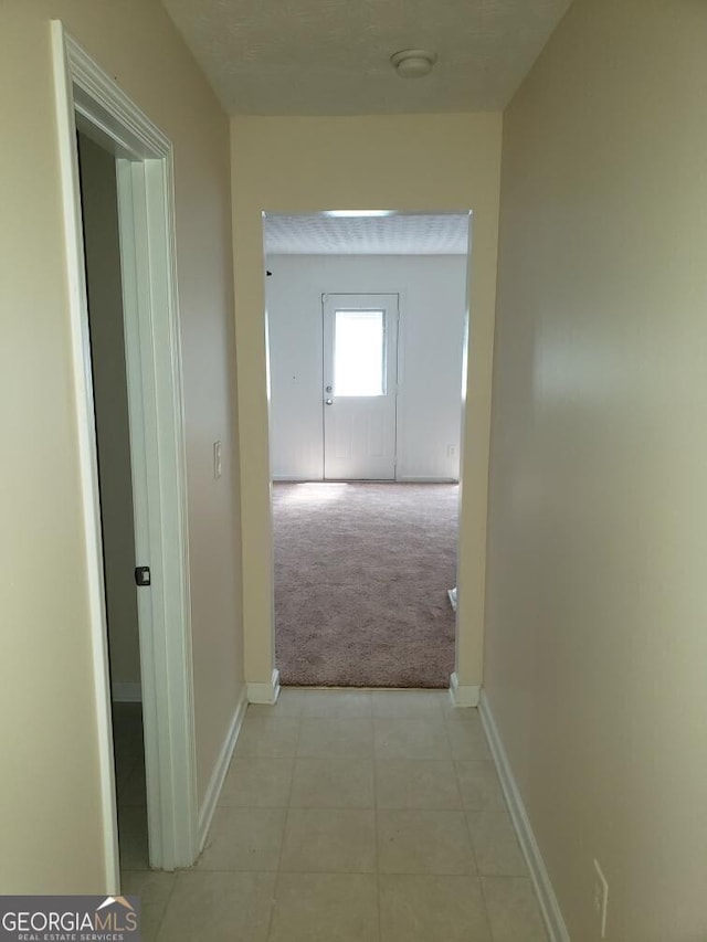 2075 Tussahaw Xing, Mcdonough, GA 30252 - hall with light carpet and baseboards