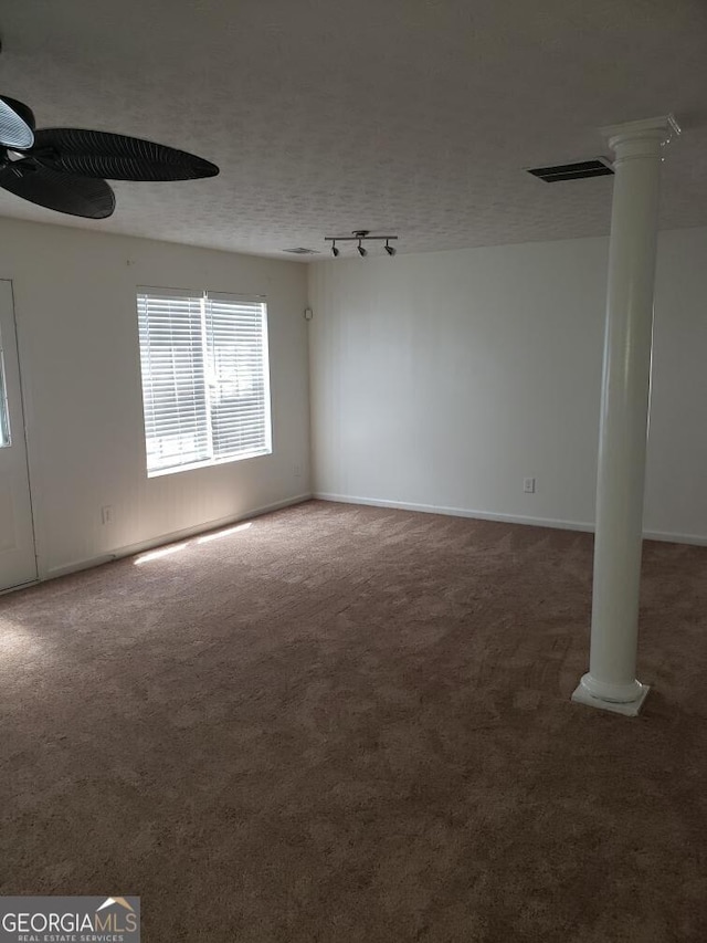 2075 Tussahaw Xing, Mcdonough, GA 30252 - carpeted spare room featuring ornate columns, a ceiling fan, track lighting, and baseboards