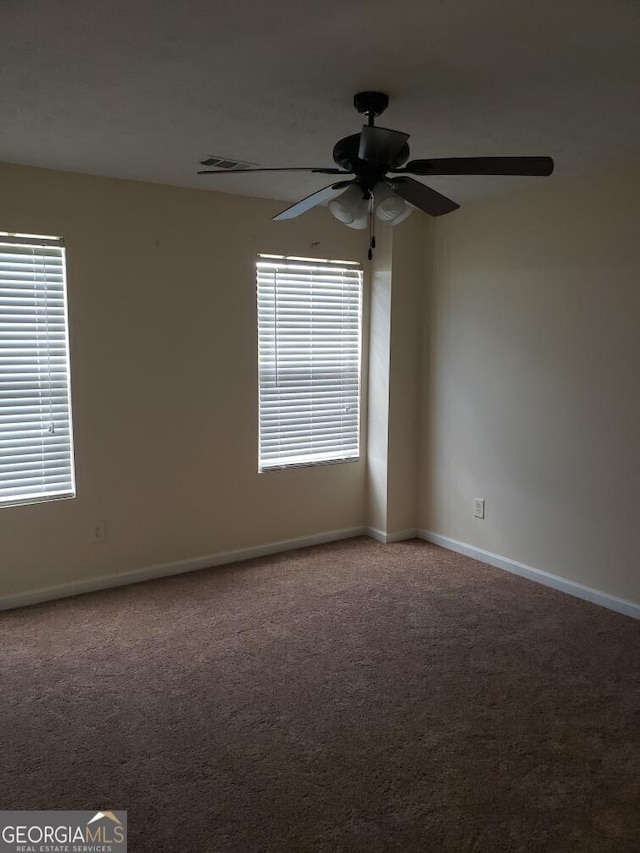 2075 Tussahaw Xing, Mcdonough, GA 30252 - unfurnished room featuring a ceiling fan, carpet, healthy amount of natural light, and baseboards