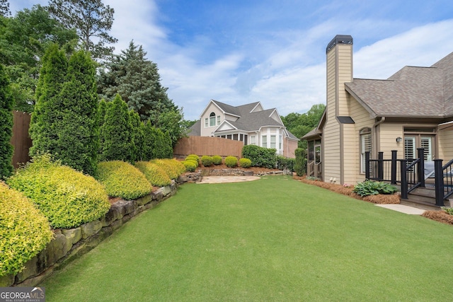 view of yard with a deck