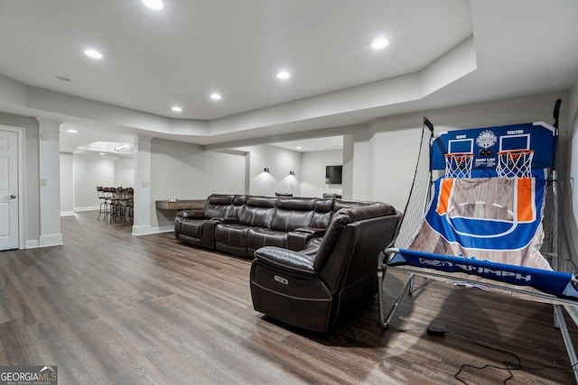 living room with wood finished floors, recessed lighting, and baseboards