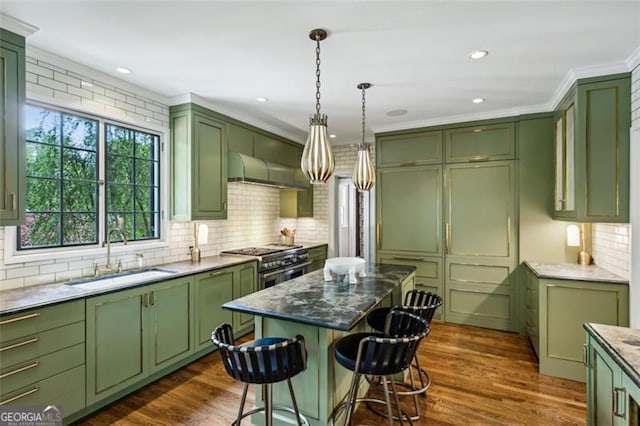3086 Pine Valley Rd, Atlanta, GA 30305 - kitchen featuring green cabinetry, a sink, ornamental molding, and recessed lighting