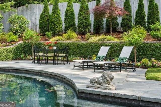 3086 Pine Valley Rd, Atlanta, GA 30305 - view of community with a patio area, fence, and a swimming pool