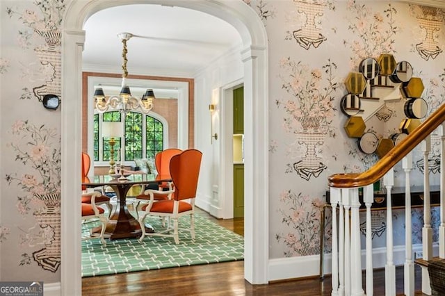 3086 Pine Valley Rd, Atlanta, GA 30305 - sitting room featuring wood finished floors, arched walkways, a chandelier, ornamental molding, and stairs