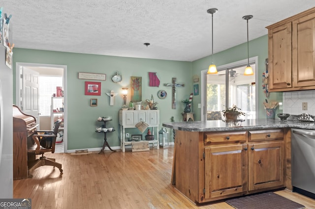 191 Roberts Way, Cornelia, GA 30531 - kitchen featuring brown cabinets, dark countertops, light wood-style flooring, and stainless steel dishwasher