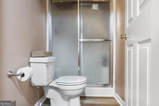 191 Roberts Way, Cornelia, GA 30531 - bathroom featuring toilet, baseboards, a shower stall, and wood finished floors