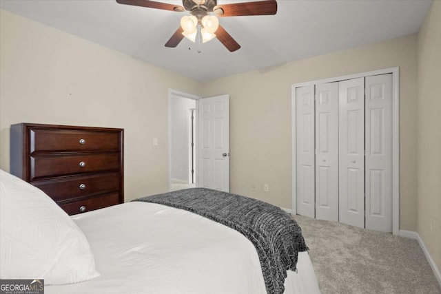 bedroom with baseboards, a closet, a ceiling fan, and carpet floors