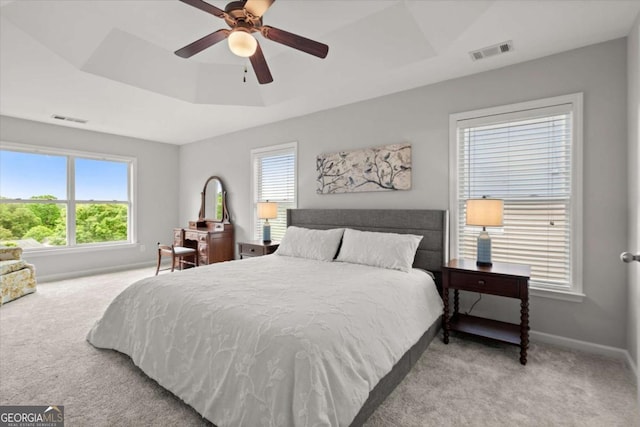 bedroom featuring baseboards, visible vents, and carpet