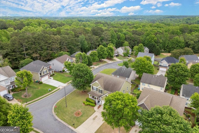 drone / aerial view with a view of trees and a residential view