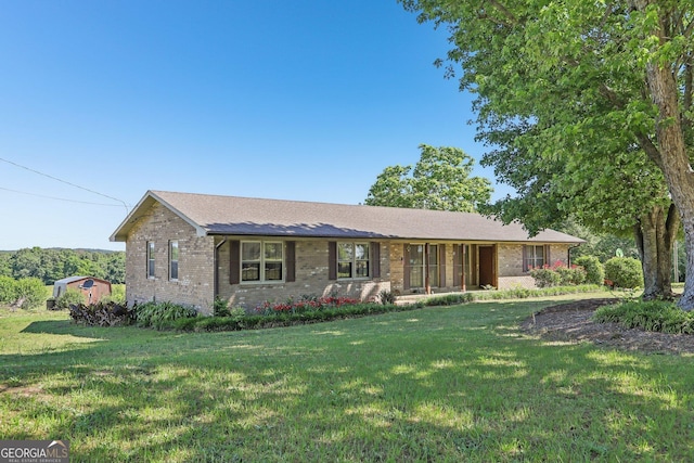 1240 C M Copelan Rd, Madison, GA 30650 - ranch-style home with brick siding and a front lawn