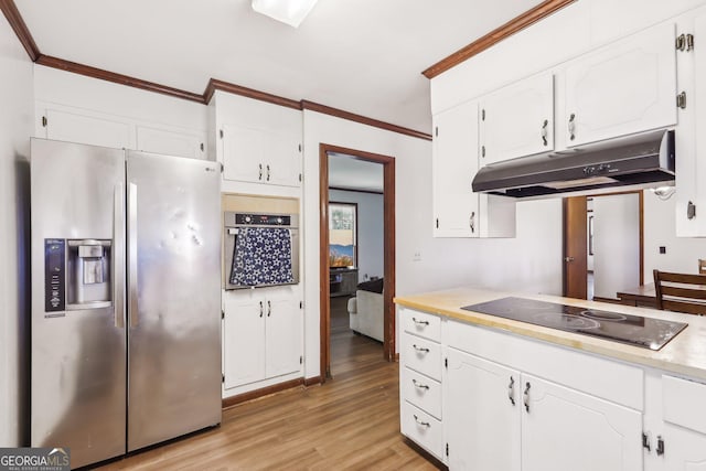 1240 C M Copelan Rd, Madison, GA 30650 - kitchen featuring stainless steel appliances, under cabinet range hood, white cabinetry, crown molding, and light wood-style flooring