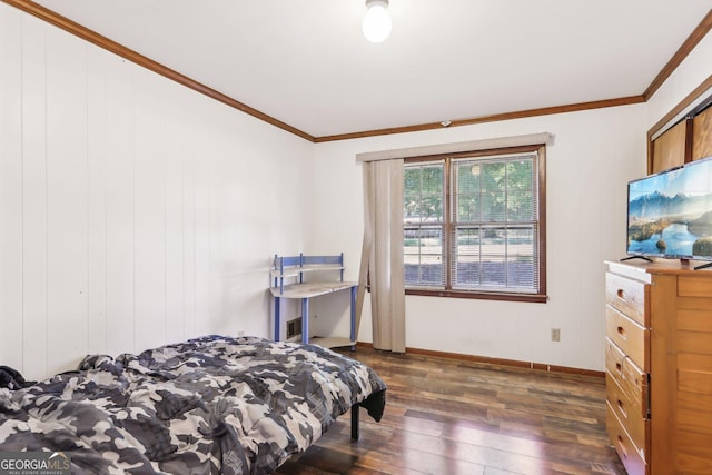 1240 C M Copelan Rd, Madison, GA 30650 - bedroom featuring dark wood finished floors, baseboards, and crown molding