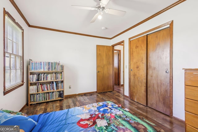 1240 C M Copelan Rd, Madison, GA 30650 - bedroom with wood-type flooring, ornamental molding, baseboards, a closet, and a ceiling fan