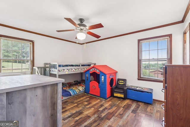 1240 C M Copelan Rd, Madison, GA 30650 - bedroom with dark wood-style floors, ornamental molding, ceiling fan, and baseboards