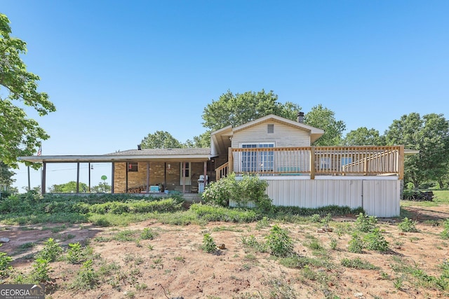 1240 C M Copelan Rd, Madison, GA 30650 - rear view of house with a wooden deck