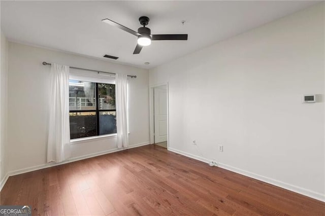 821 Ralph Mcgill Blvd NE Unit 2113, Atlanta, GA 30306 - spare room featuring ceiling fan, baseboards, and wood finished floors